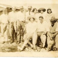 11 People Posing with Fish