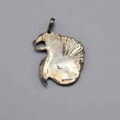 Pendant given to Nancy Loewy for working at The Monster Restaurant and Discoteque: © Key West Art & Historical Society
