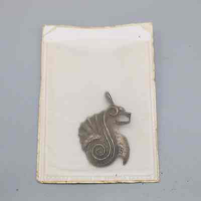 Pendant inside plastic pouch: © Key West Art & Historical Society