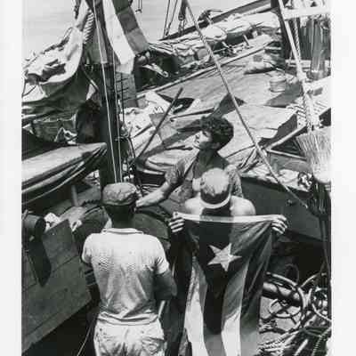 Men Aboard a Cuban Sailboat