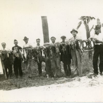 Men with Hanging Fish
