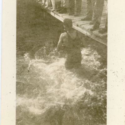 Man in Water by Dock