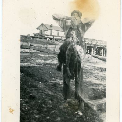 Man Holding Many Fish on Rope