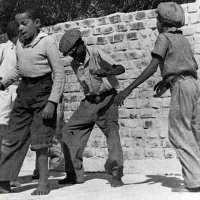 Young Boys Dancing in Front of Hemingway Home