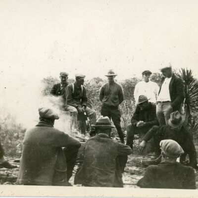 Group of Men by a Fire