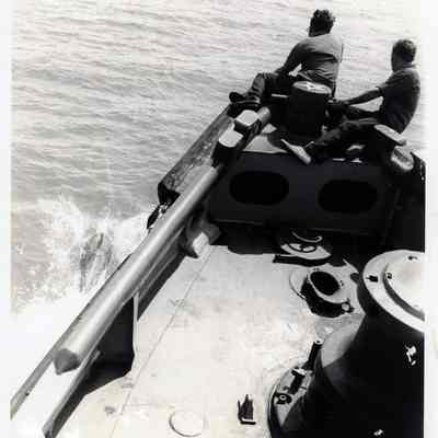 US Navy Personnel on Ship's Bow