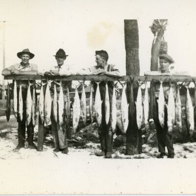 Men with Hanging Fish