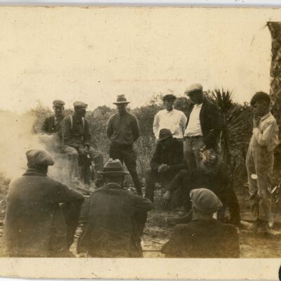 Group of Men by a Fire