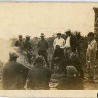 Group of Men by a Fire