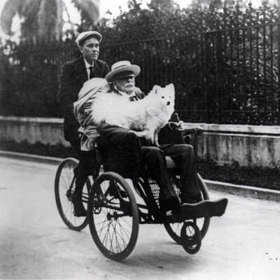 Henry M. Flagler Riding in his Bike Chair