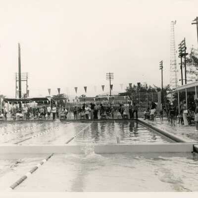 A group of unknown people at a pool