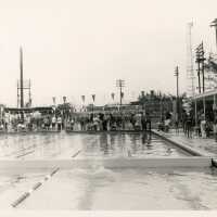 A group of unknown people at a pool