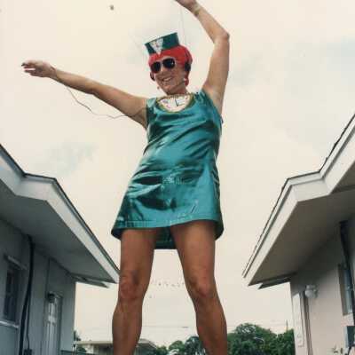 Unknown person dressed up standing on a table.