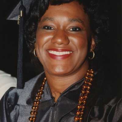 Unknown woman dressed up in a cap and gown.