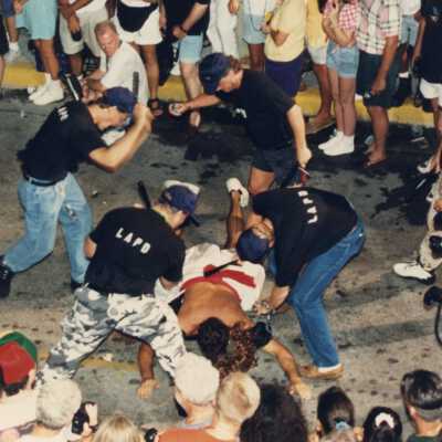 Unknown people walking in the street for the parade.