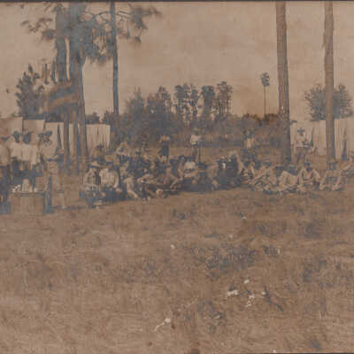 Group of soldiers eating near tents