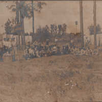 Group of soldiers eating near tents