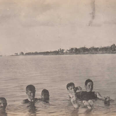 Group of men in water