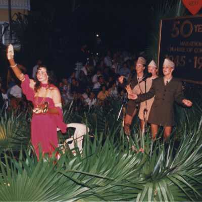 Four unknown woman on a stage.