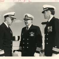 3 Unknown men in uniform talking