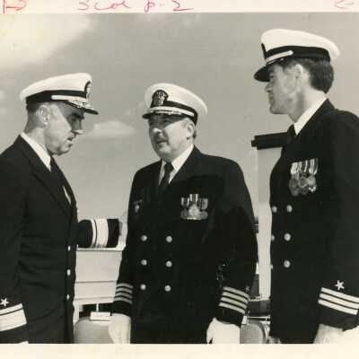 3 Unknown men in uniform talking