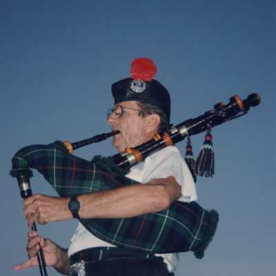 An unknown member of the St. Andrews pipe band playing.