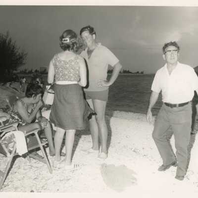 A group of unknown people at the beach