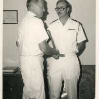 2 Men in uniform shaking hands