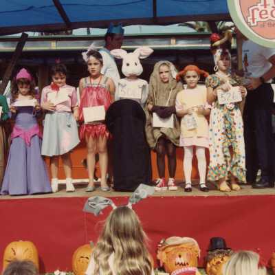 A group of unknown children dressed up at children's day.