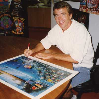 An unknown man writing or signing a poster.