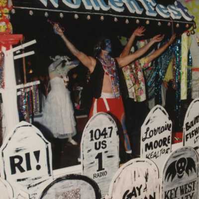 A float in the parade that reads Woman Fest.