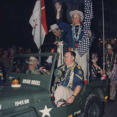 Unknown people in a jeep in the parade.