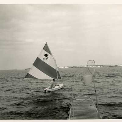 Unknown man in a sailboat in the ocean