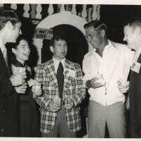 An Unknown group of people talking at a party