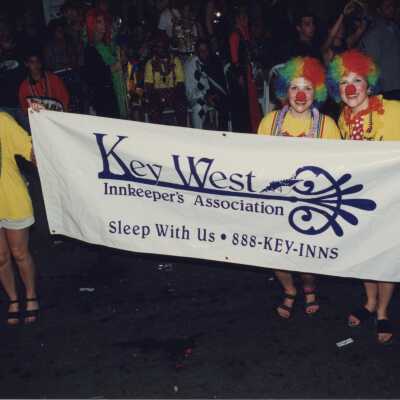 Unknown people holding a banner that reads Key West Inkeepers Association.