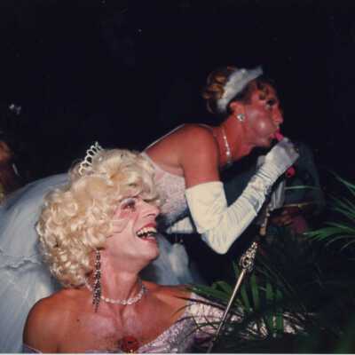Unknown men dressed up as woman at the Coronation Ball.