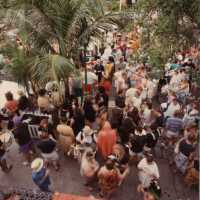 An Unknown group of people standing outside, some are dressed up in front of the Tropical Inn at 812 Duval Street.