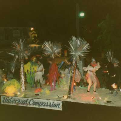 A float in the parade that reads Universal Compassion.