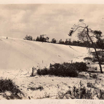 Sand dune and telephone poles