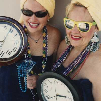 Two unknown woman dressed up.