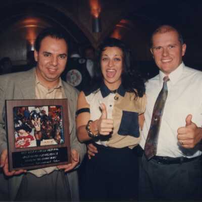 Three unknown people at the Call of the Wild awards ceremony.