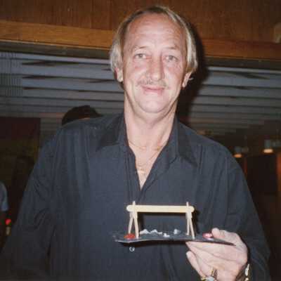 An unknown man at an award ceremony.