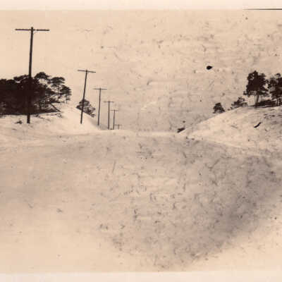 Sand dune and telephone poles