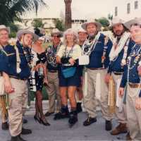 A group of unknown people dressed up.