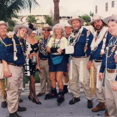 A group of unknown people dressed up.