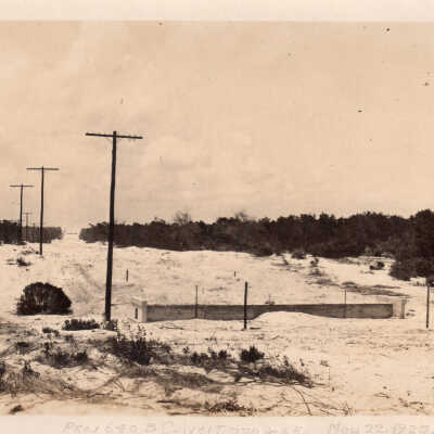 Sand dune and telephone poles