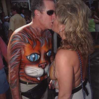 Two unknown people with painted bodies.