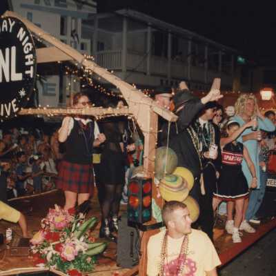A float in the parade that reads Saturday night live.