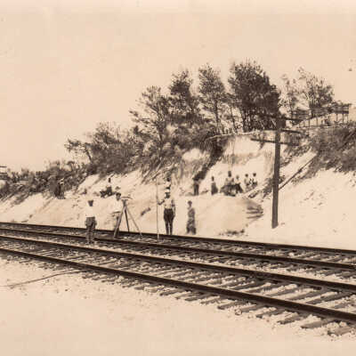 Men on railroad tracks