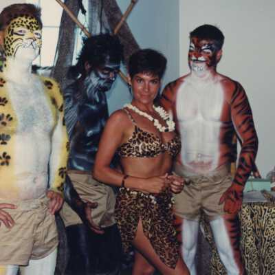 4 unknown people dressed up.